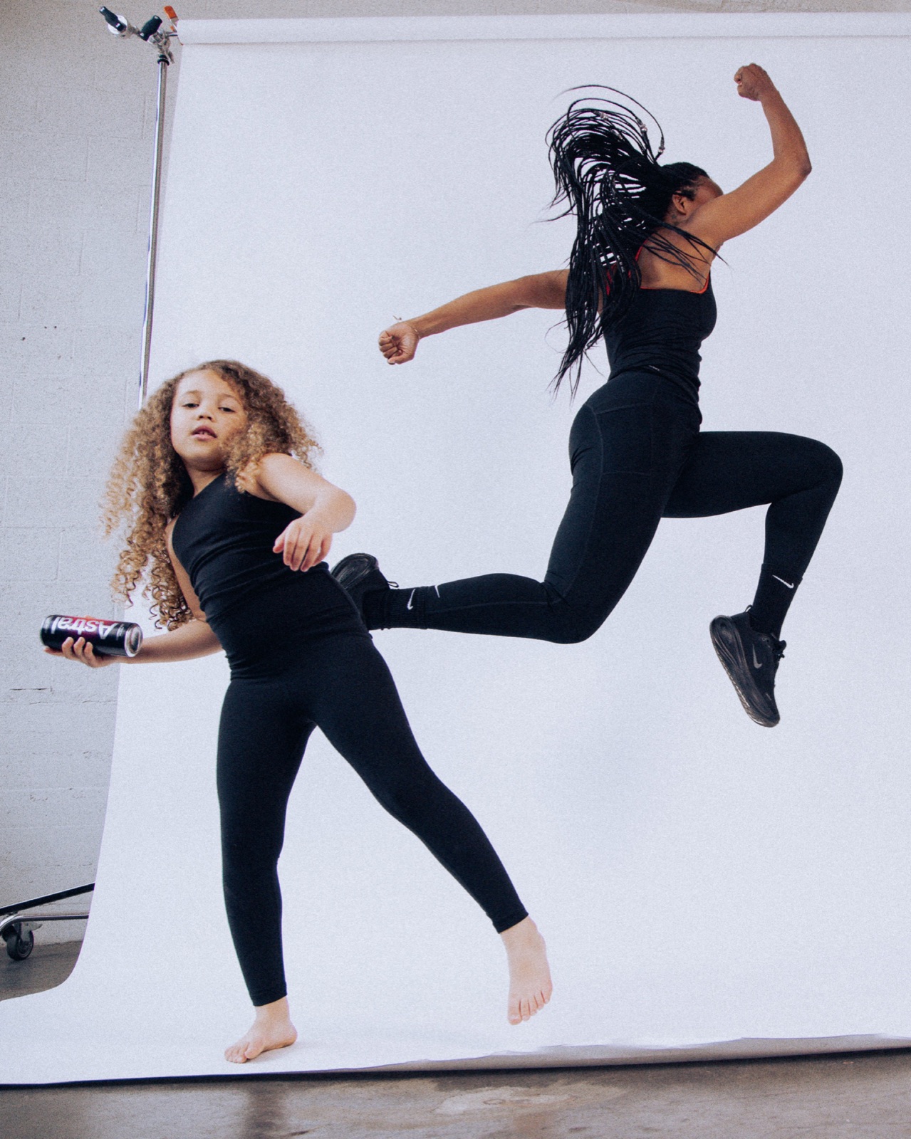 Mother and daughter jumping in a studio, Astral Mother's Day campaign