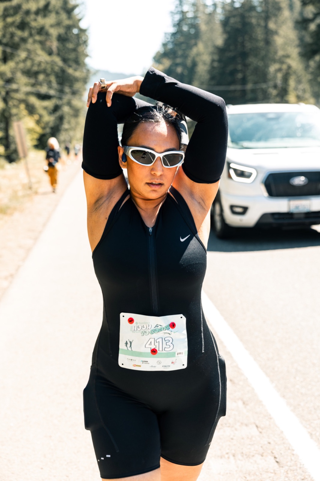 Runner with arms overhead on race day