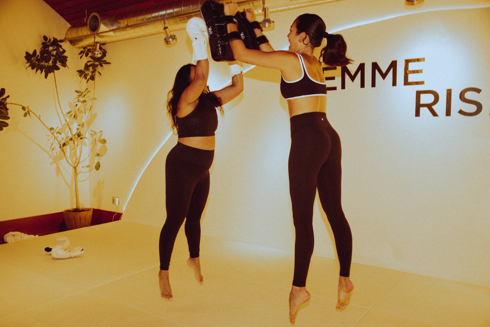 Women kickboxing at a Femme Rising training session